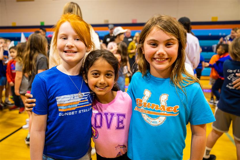 Students and families participate in a fun run